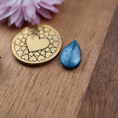 Bowlerite Cabochon - approx. 12 x 8 x 3.6 mm