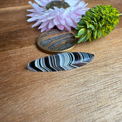 Fordite Cabochon - approx. 27 x 7 x 3.8 mm