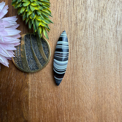 Fordite Cabochon - approx. 27 x 7 x 3.3 mm
