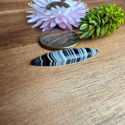 Fordite Cabochon - approx. 27 x 7 x 3.3 mm