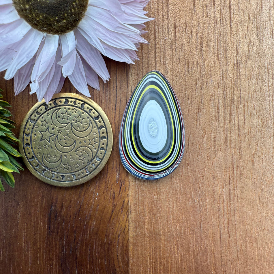 Fordite Cabochon - approx. 23 x 14 x 3.8 mm