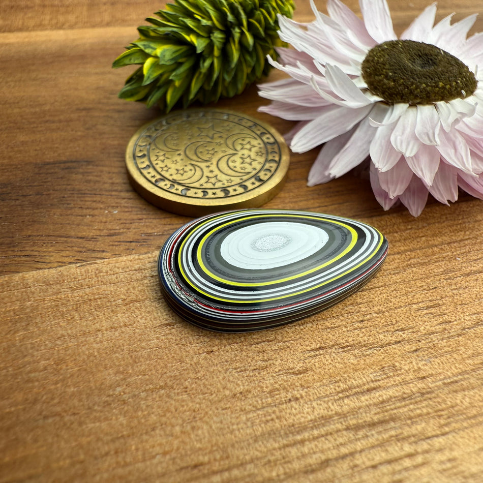 Fordite Cabochon - approx. 23 x 14 x 3.8 mm